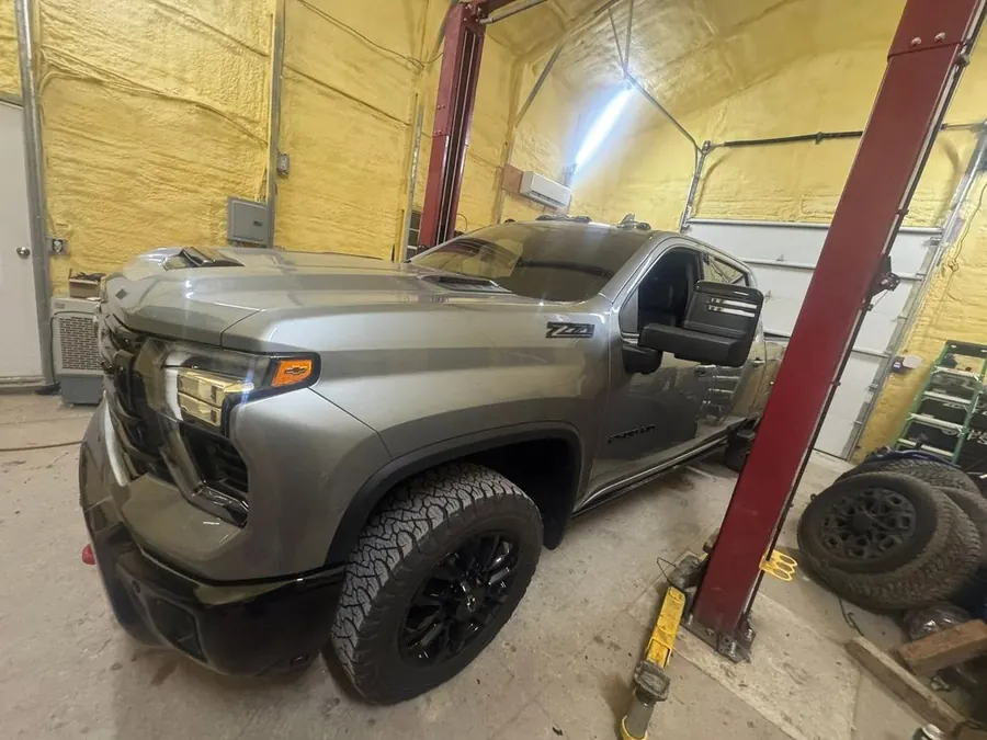 A heavy-duty diesel pickup in the High Torque service bay