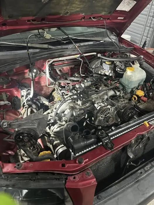 A Subaru engine bay during an engine swap