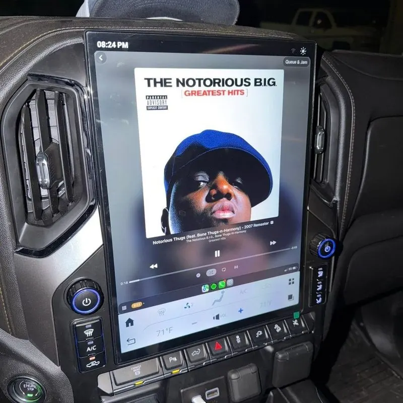 GM truck dash with a large aftermarket touchscreen radio installed